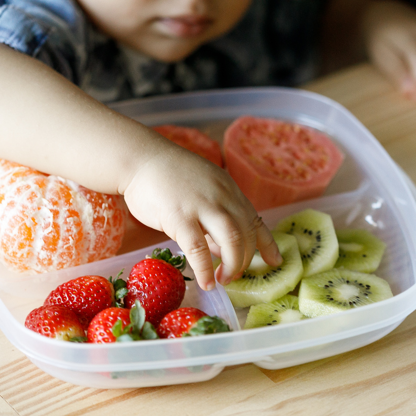 Baby eating fruits and vegetables